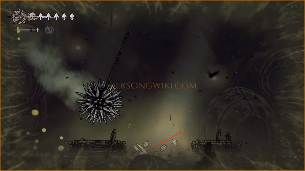 The Spike Ball trap swings harmlessly over Hornet, who is safely submerged in the corner of the arena.