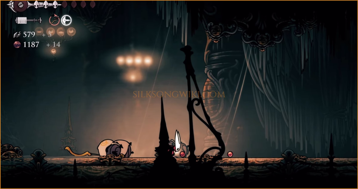 Hornet collects another dropped Choir Cloak after a fight.