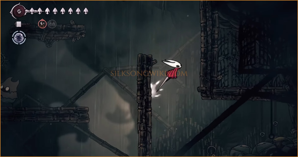 Hornet platforming across the upper prison cells in Greymoor.