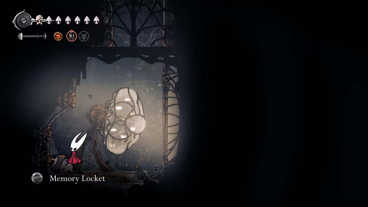 Collecting the Memory Locket at the top of the room.